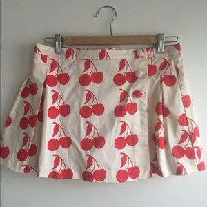 Pleated cherry mini skirt